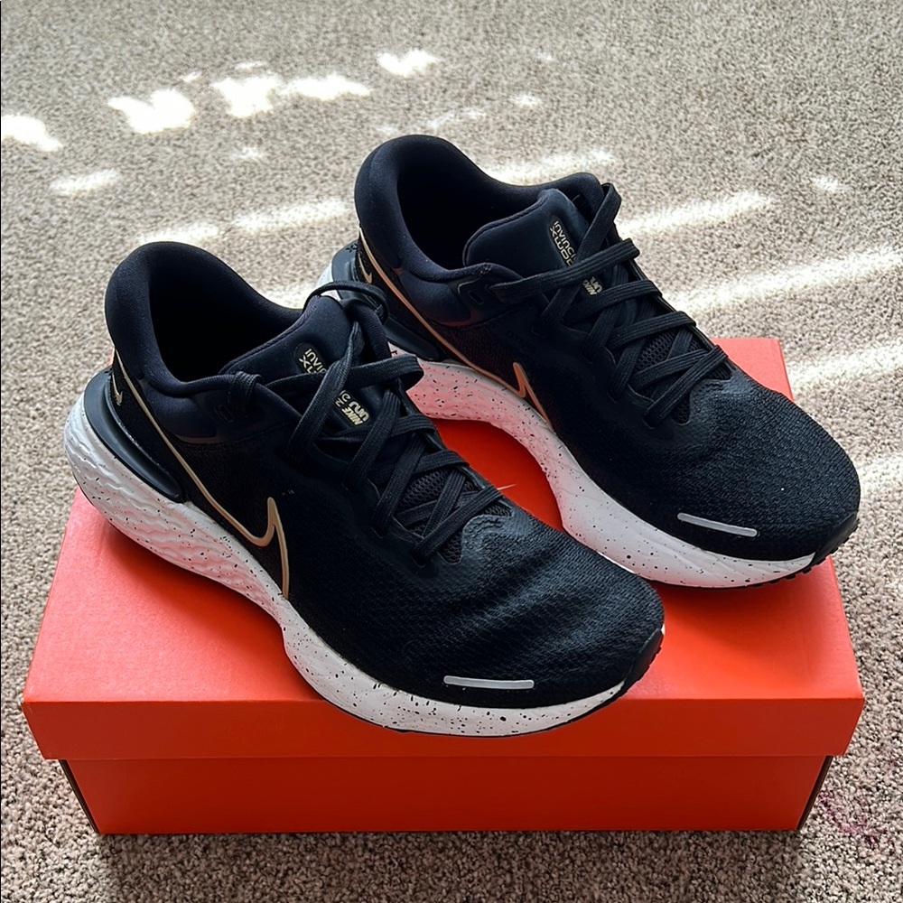 Nike Zoom X Invincible Black and White Running Shoes with Gold Accent